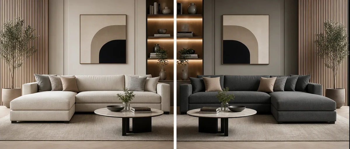 Beige left-facing and dark grey right-facing chaise sofas with round coffee table and abstract art in a living room