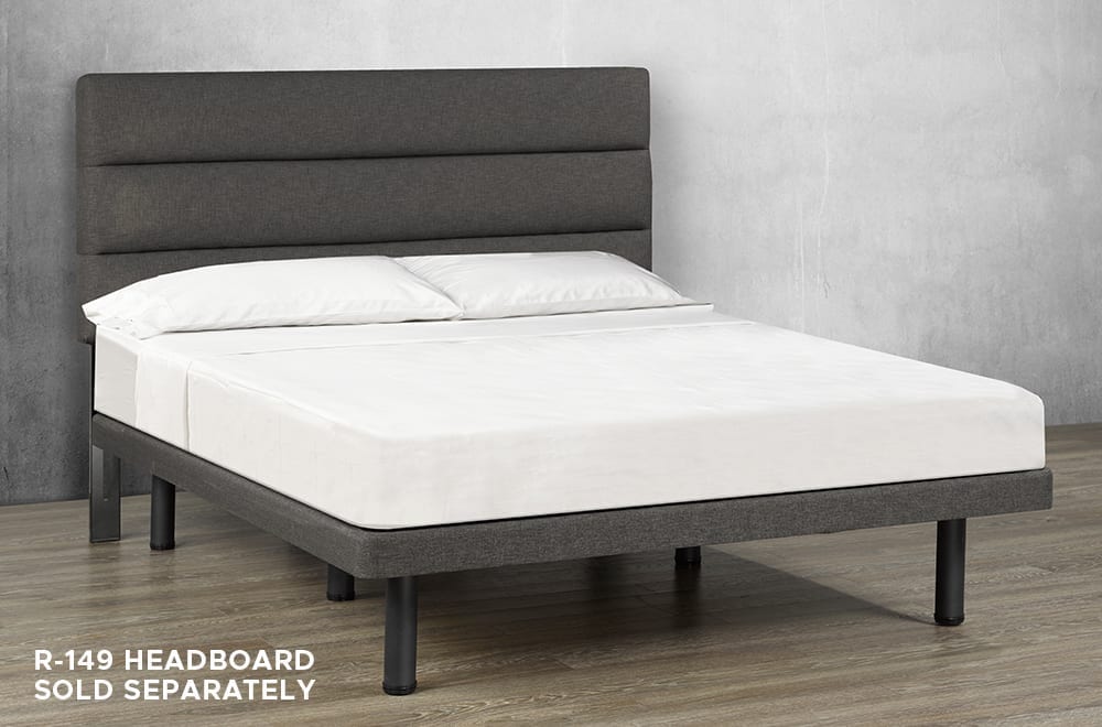 Gray upholstered platform bed frame with a low-profile base, black support legs, and a matching upholstered headboard.