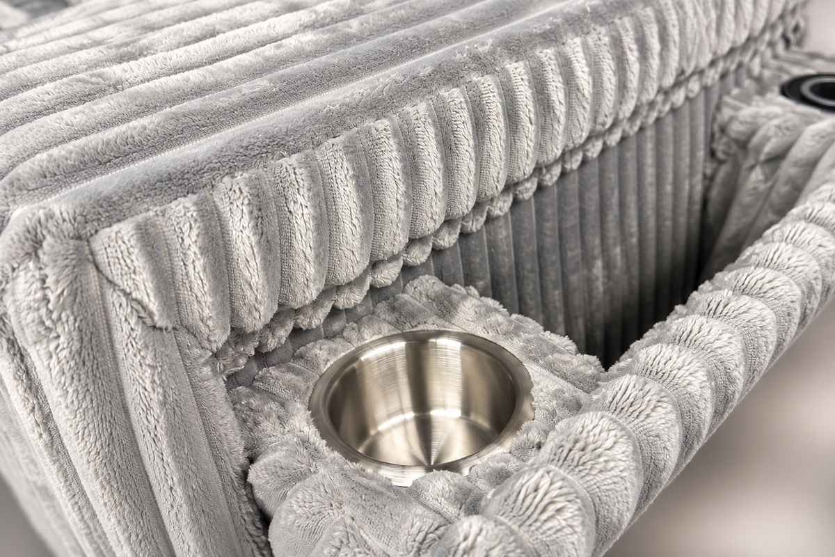 Close-up of the Aspan grey sectional sofa arm compartment showing cup holders and ribbed upholstery
