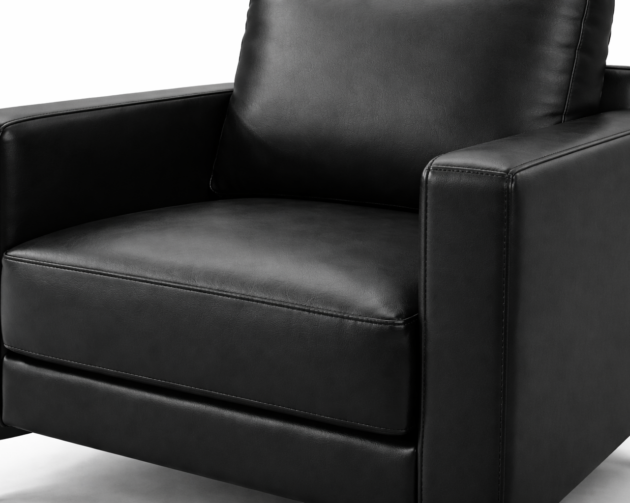 Close-up angled view of black leatherette sofa showing smooth texture and stitching detail