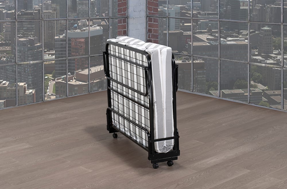 Folded rollaway bed with a black metal frame, white striped mattress, and caster wheels.