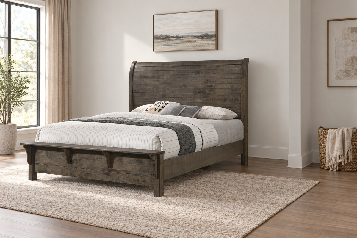 Margaret grey bed frame with a curved panel headboard and matching footboard, styled with bedding in a bright bedroom.