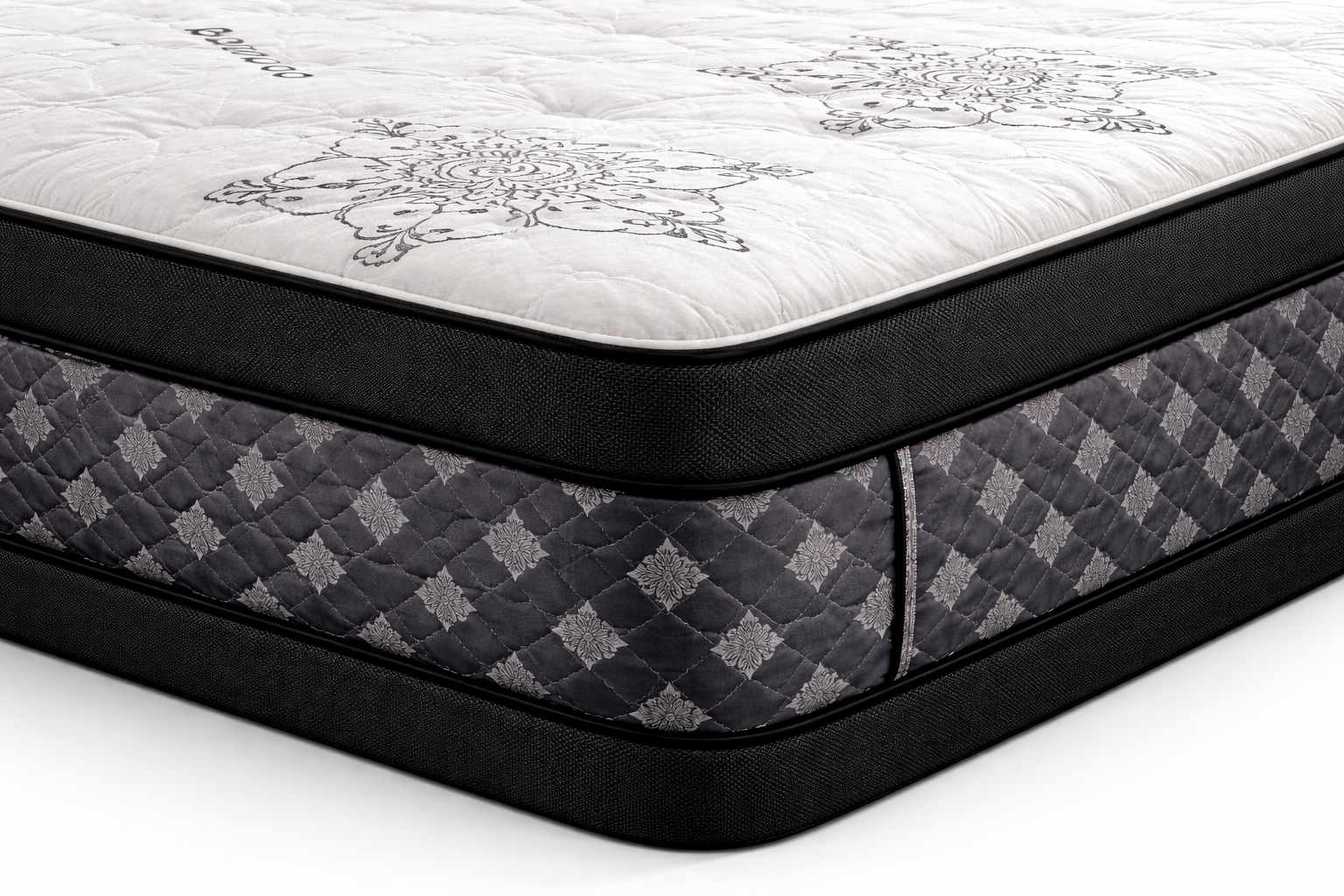 Close-up corner view of Royal Premium Double Sided pillow top mattress showing quilted white top, black piping edge, and grey diamond-patterned side panel.