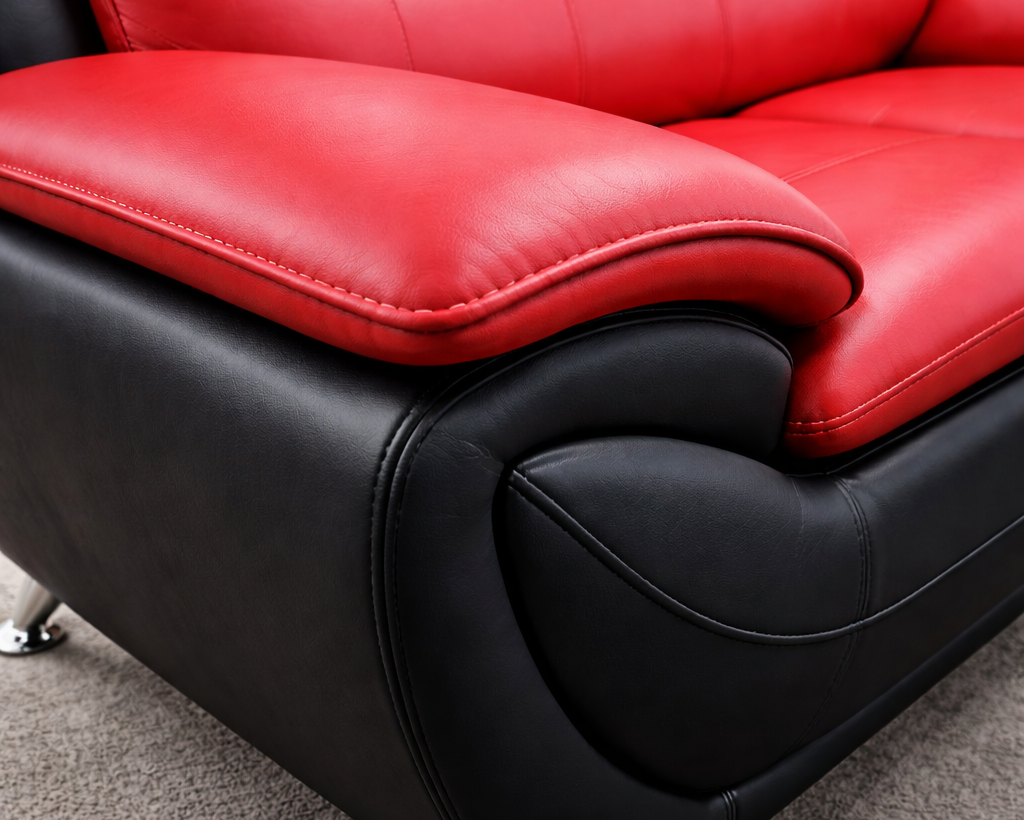Close-up angled view of Speedy red and black leather sofa showing texture and stitching detail