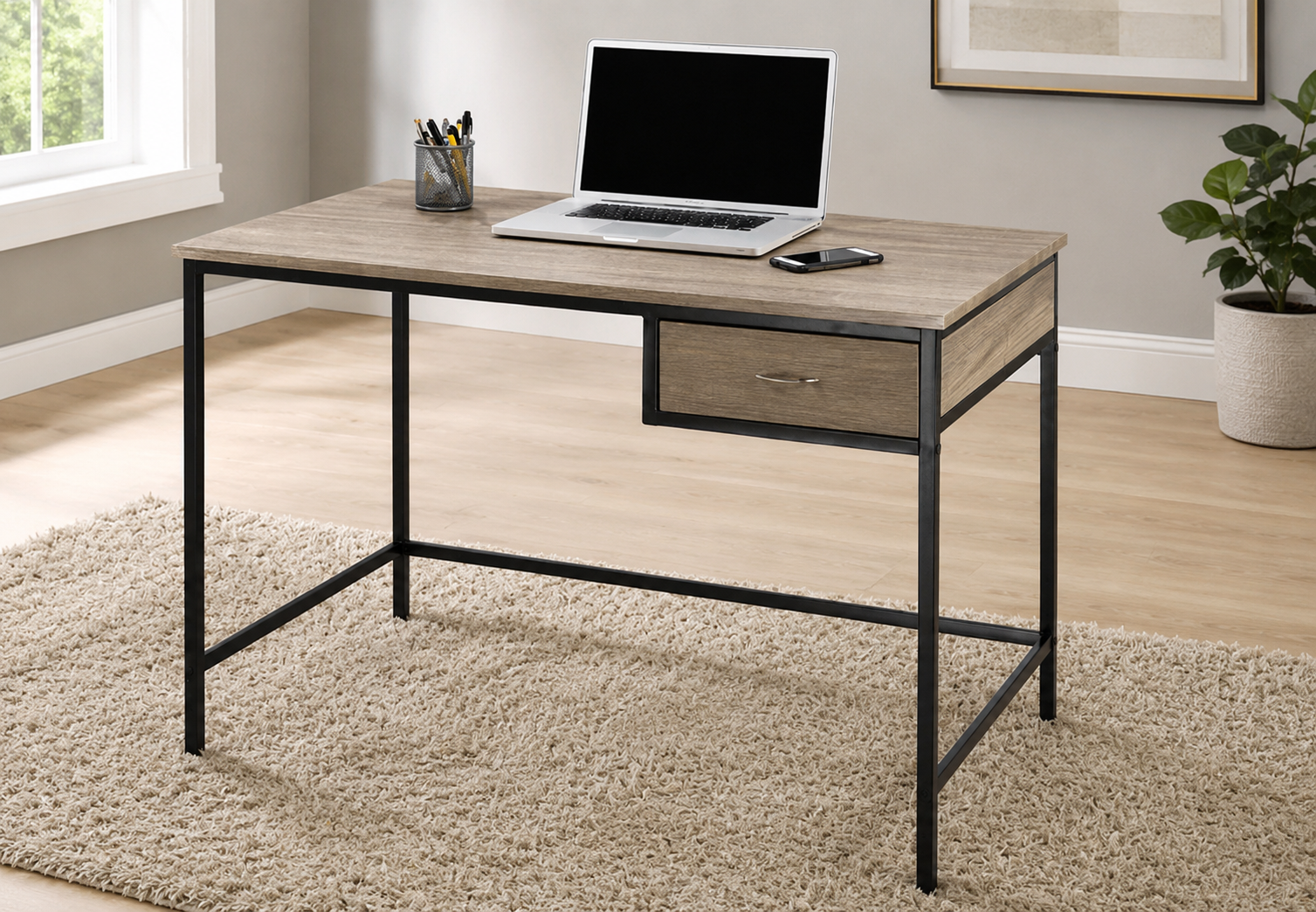 Light wood office desk with a black metal frame, single drawer, and open modern design in a neutral home office.