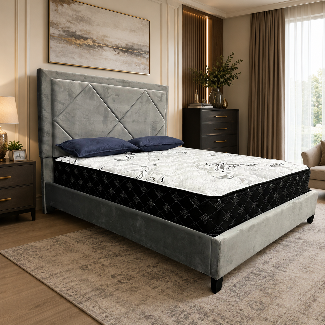 Grey upholstered bed frame with diamond-tufted headboard, black-and-white mattress, and navy pillows in a luxury modern bedroom setting.