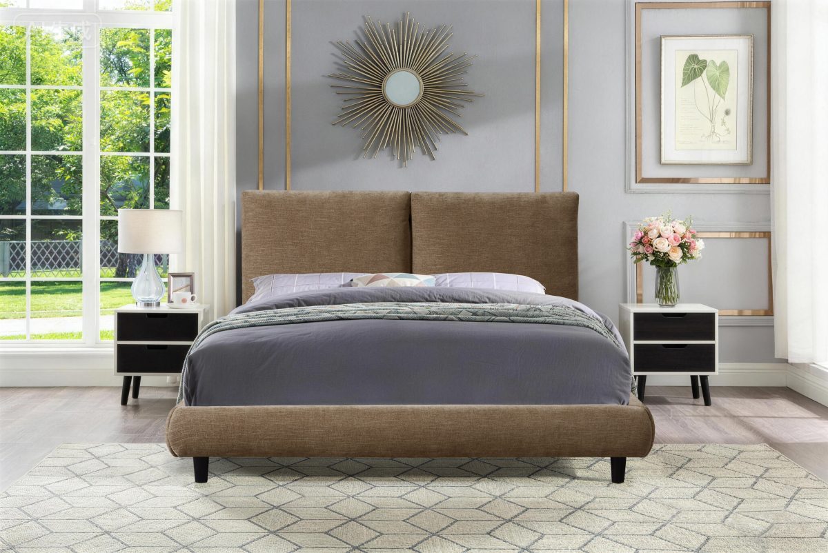 Bronze Cunard Platform Bed viewed from front with padded base, bedding and nightstands with lamp and flowers