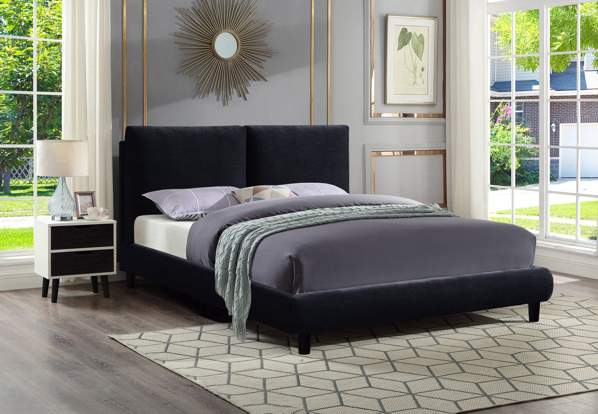 Midnight blue Cunard platform bed angled with bedding, light grey knitted throw, geometric rug, beside large window