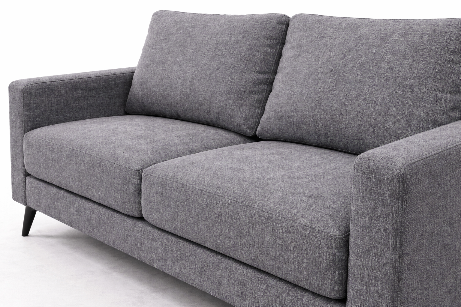 Close-up angled view of charcoal linen fabric loveseat showing detailed woven texture and stitching