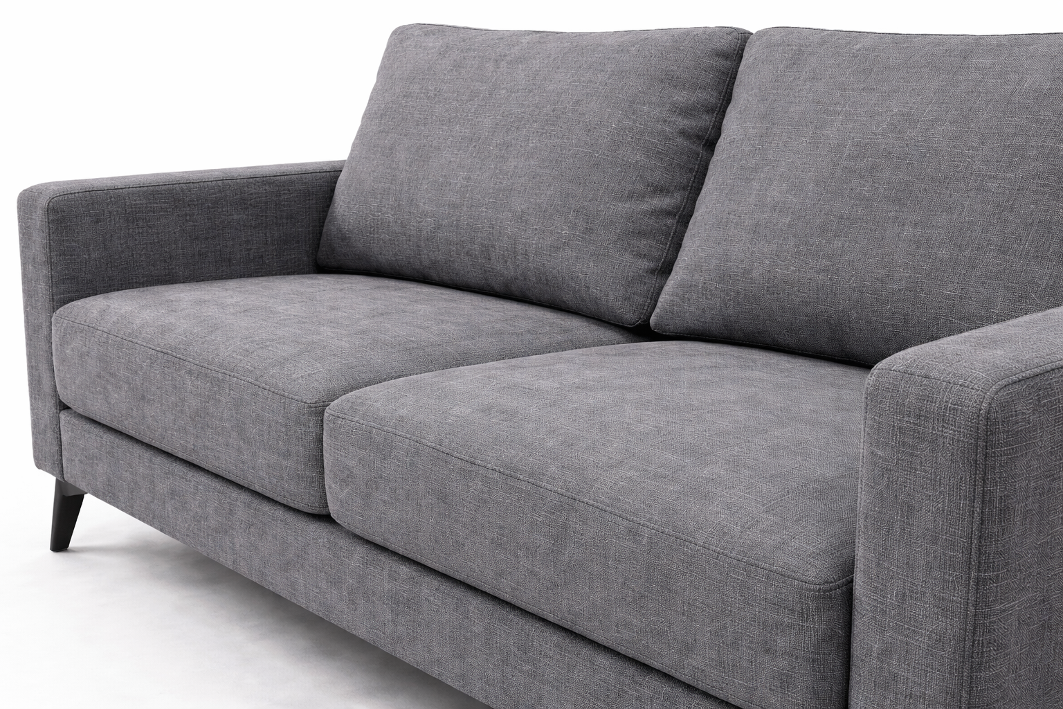 Close-up angled view of charcoal linen fabric sofa showing detailed woven texture and stitching