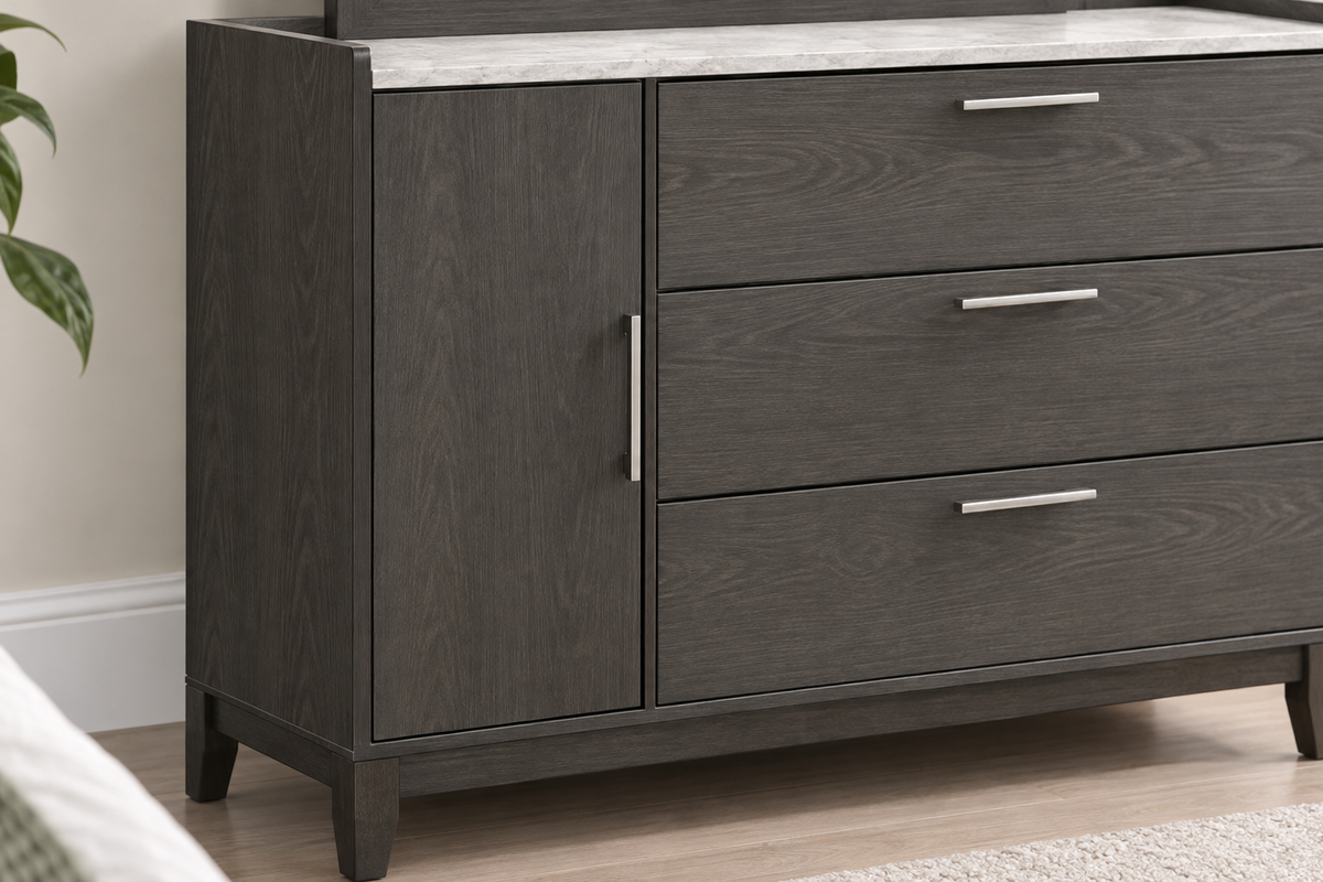 Close-up of the Juliet grey dresser showing wood-grain drawer fronts, a side cabinet, metal handles and a light-coloured top.