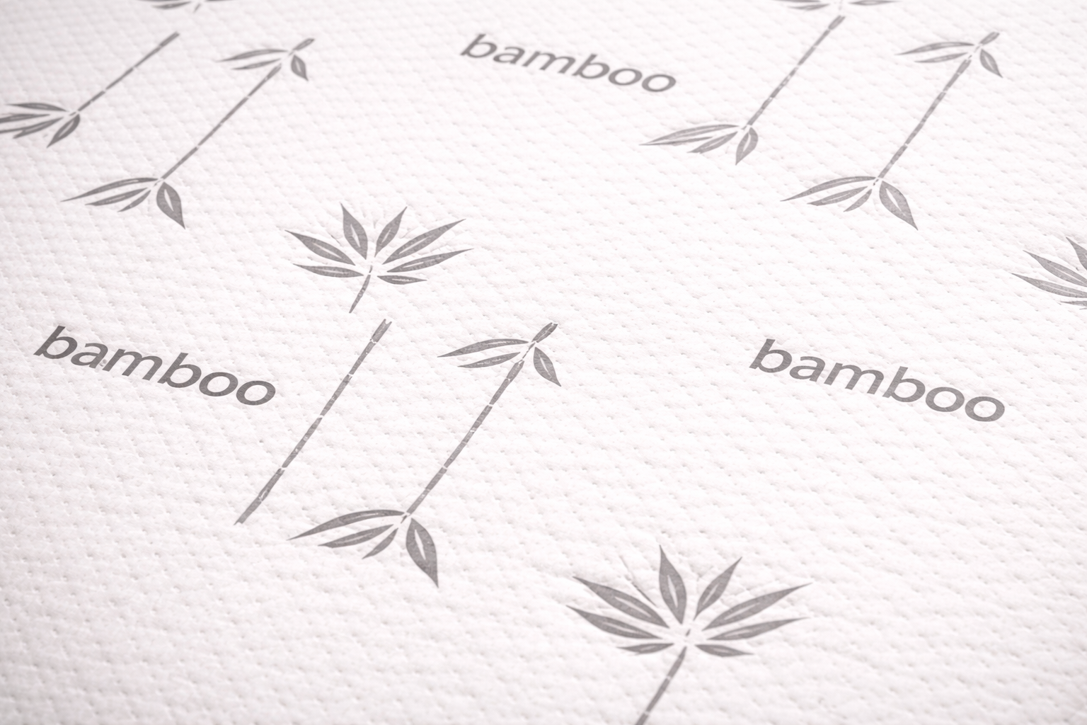 Close-up of Marrisa 10 Inch bamboo smooth-top mattress with grey leaf pattern under professional lighting
