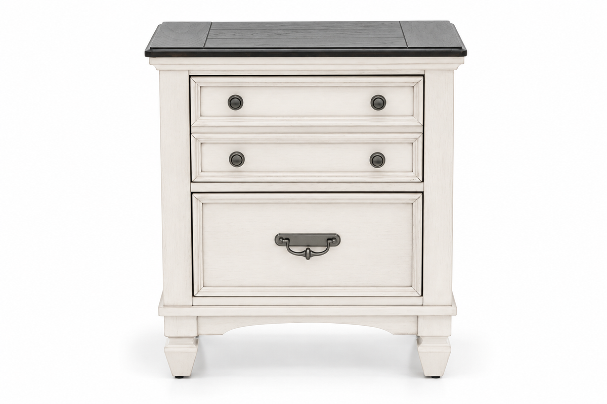 Natasha antique white nightstand with three drawer fronts, round knobs, a metal handle and a dark top, shown on a white background.