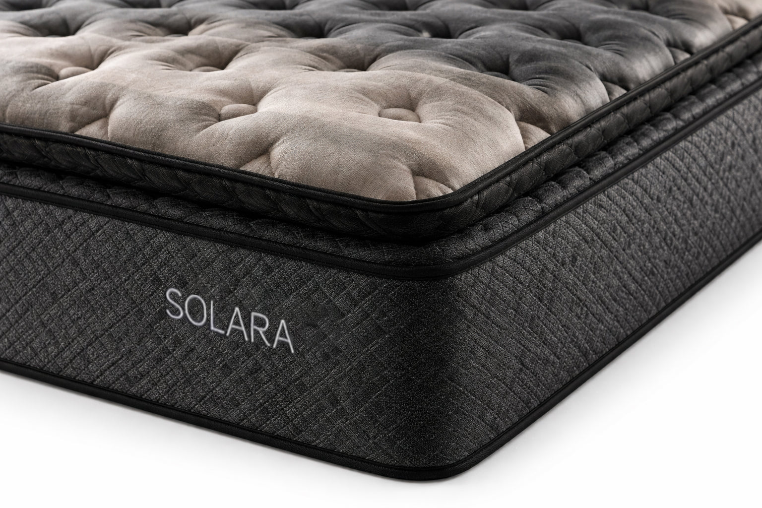 Close-up corner view of Solara mattress showing stitching, pillow top edge, and side fabric texture.