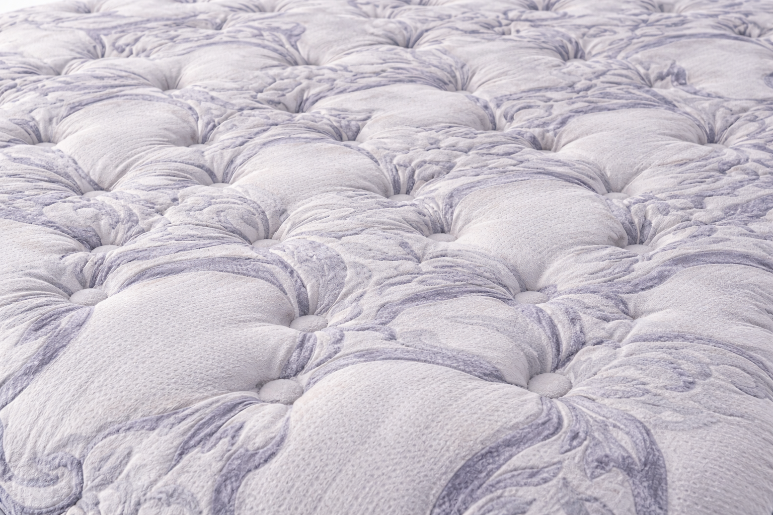 Close-up of the Tension Ease Luxury memory foam mattress fabric showing texture, stitching, and material detail
