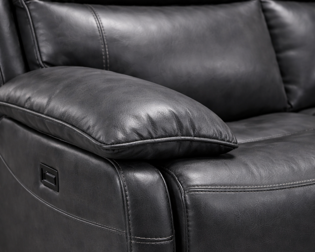 Trafalgar Close-up angled view of dark grey leather recliner showing leather grain texture and stitching detail